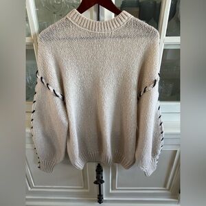 Cozy Cream Knit Sweater with Black Stitching Detail